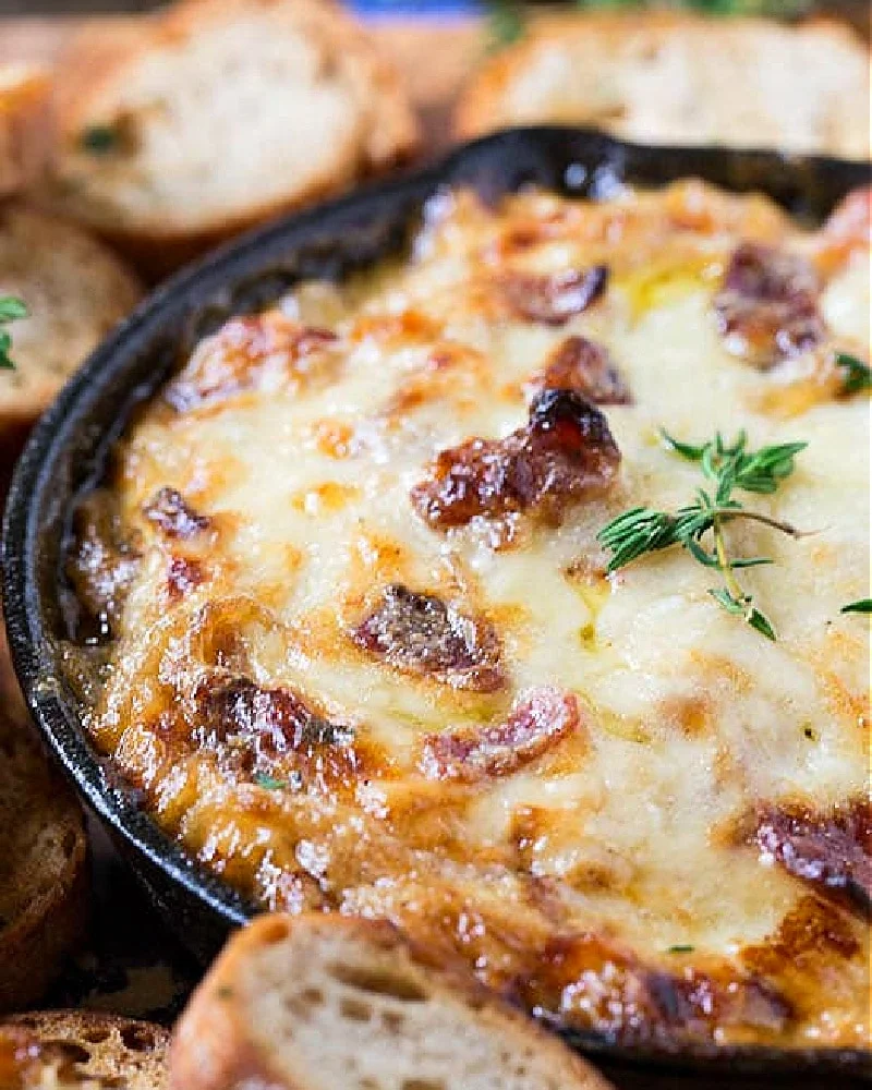 Onion Dip with Bacon and Gruyere in a cast iron skillet.