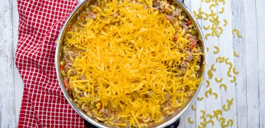 Cheese added to the pan.