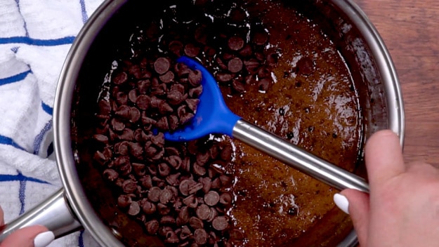 Mixing in chocolate chips.