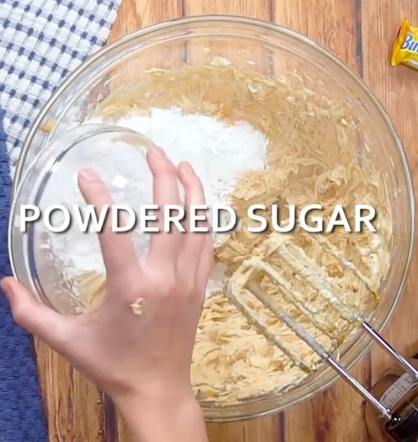 Adding powdered sugar.