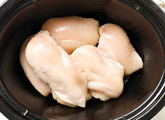 Chicken placed in slow cooker.