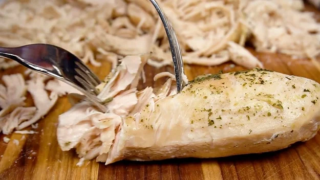Shredding the chicken.