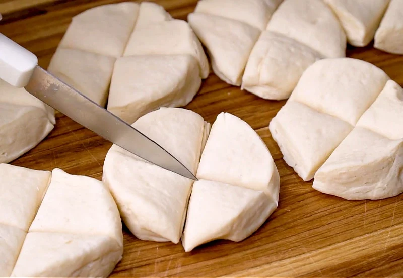 Cutting biscuits into fourths.