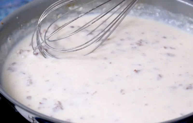 Sausage gravy mixture in pan.