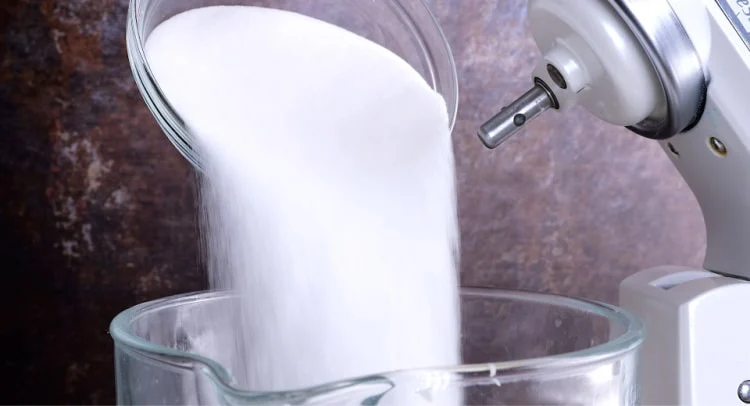 Adding sugar.