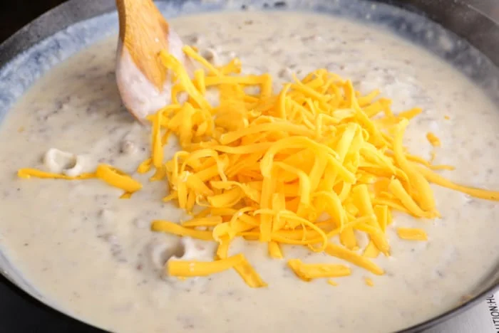 Adding the cheese.