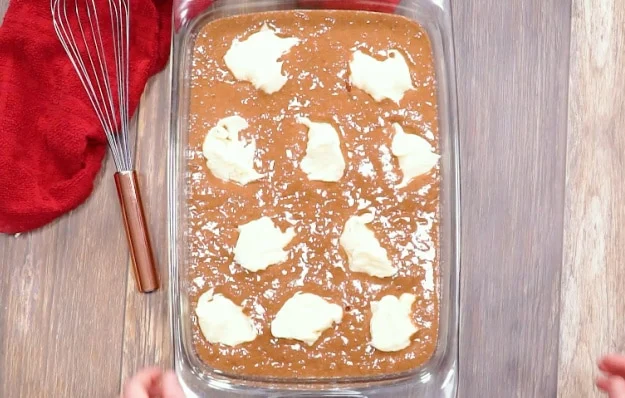 Dollops of cream cheese over batter.