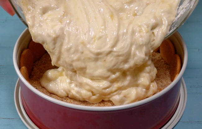 Pouring batter into pan.
