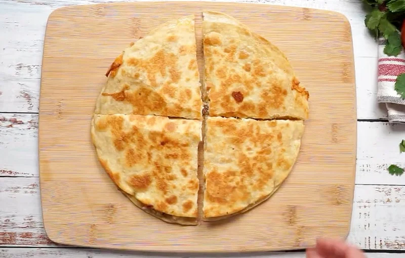 Quesadilla cut into fourths.