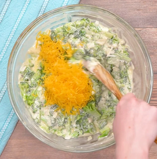 Mixing in the cheese.