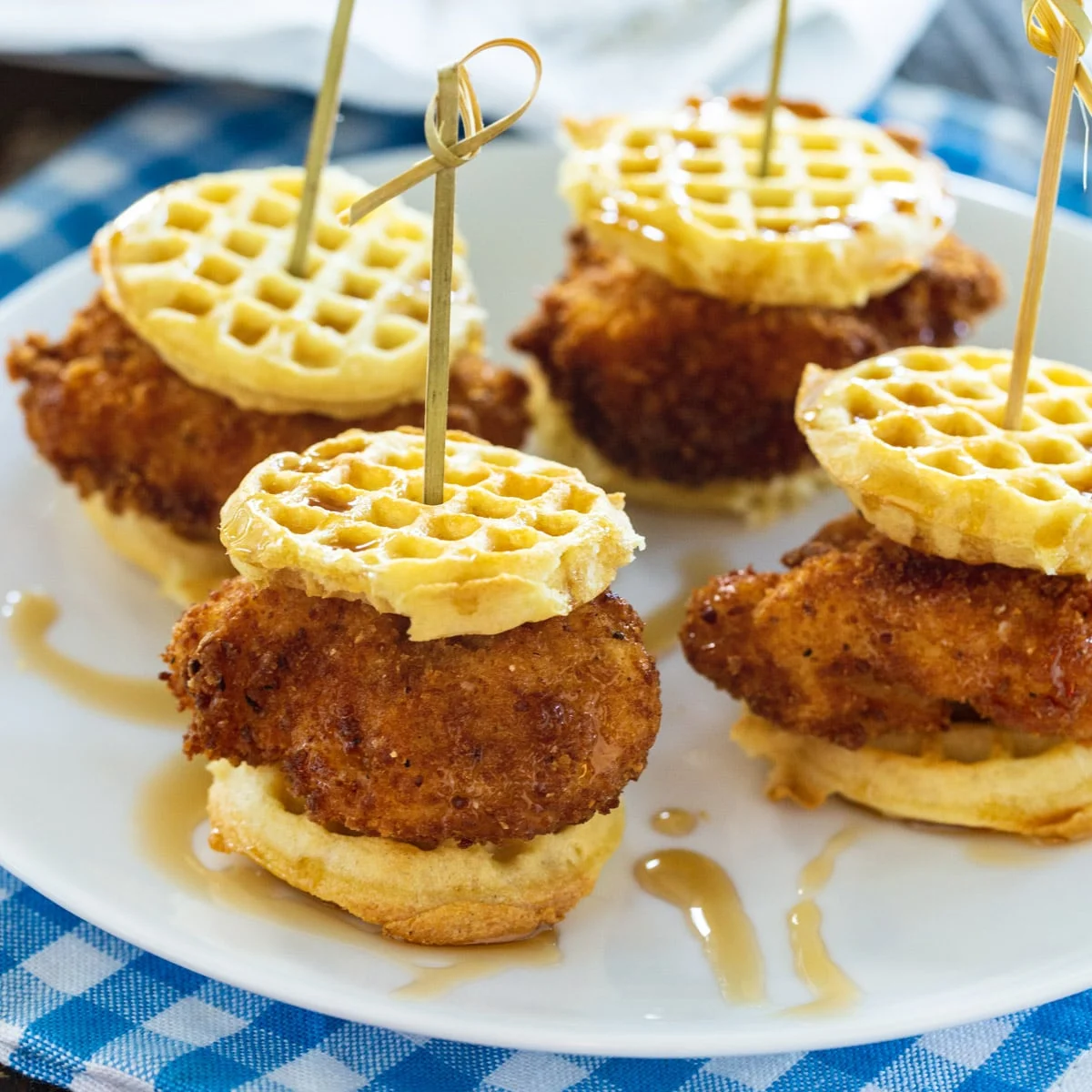 Four Chicken and Waffle Sliders on a plate.