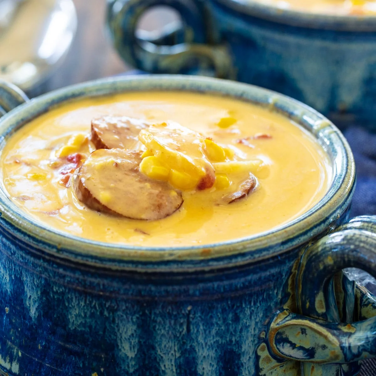 Potato Soup in a rustic blue bowl.