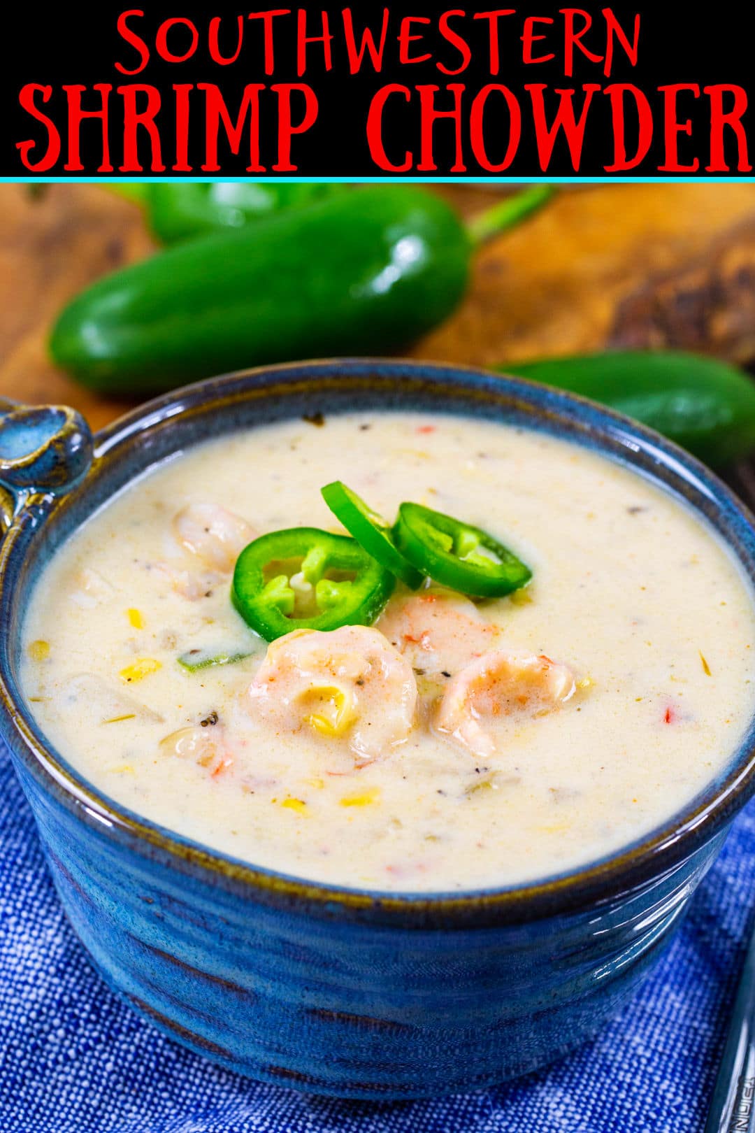 Chowder topped with jalapeno slices in a blue bowl.