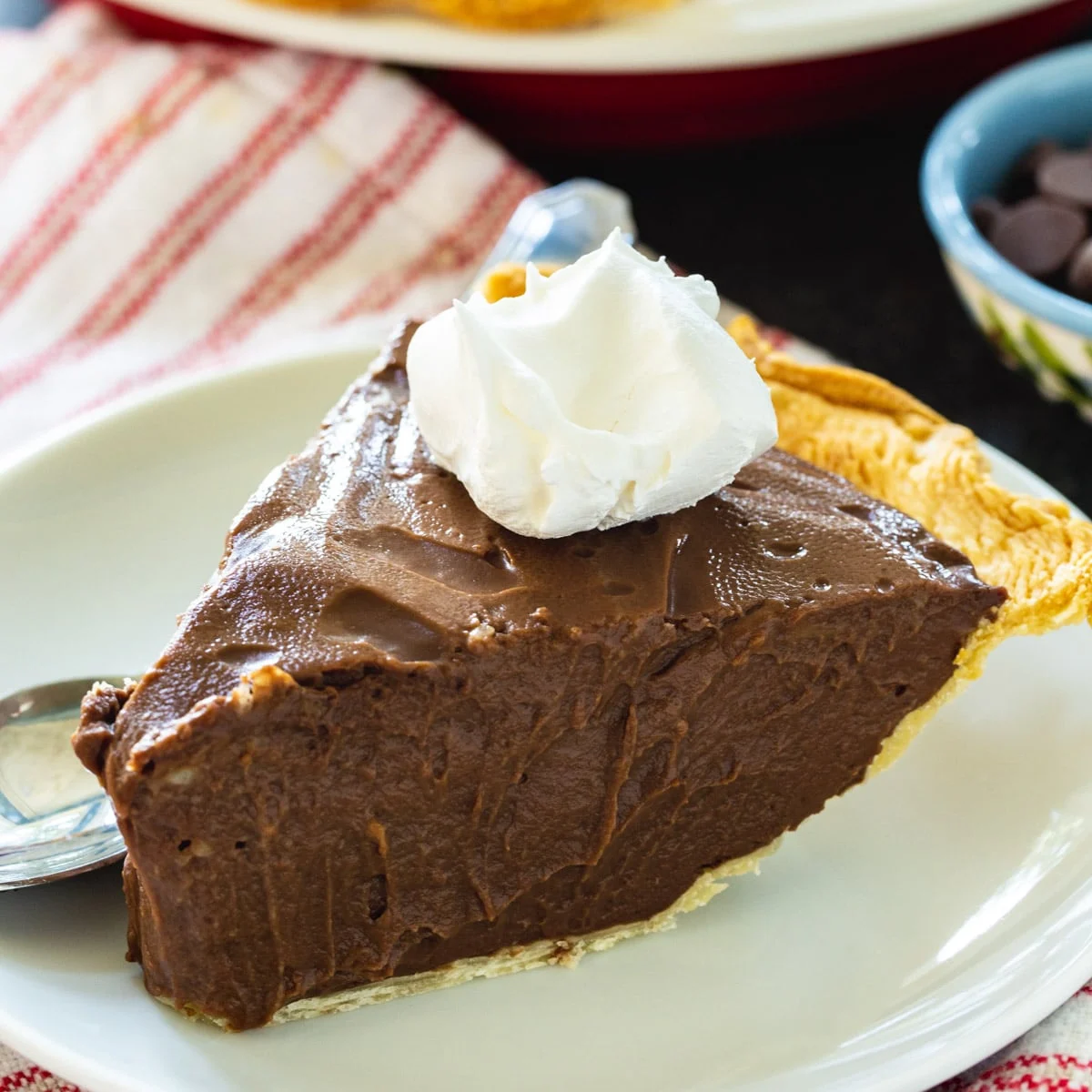 Dark Chocolate Pie topped with whipped cream.