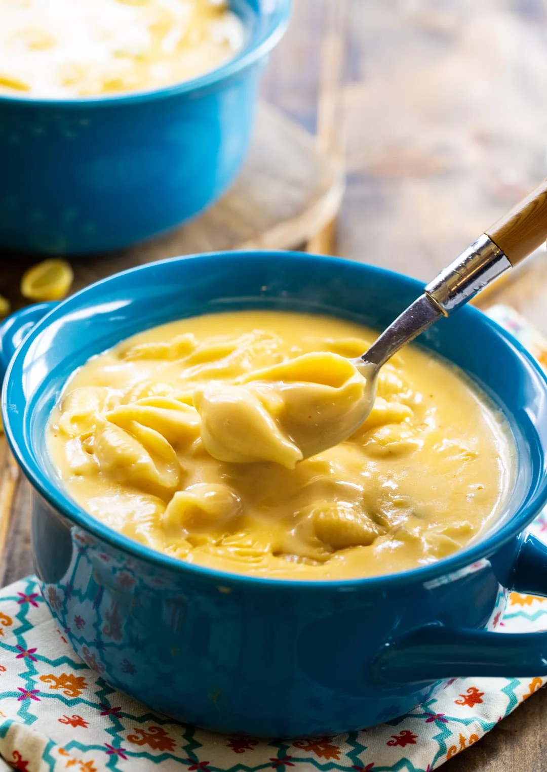 Spoon scooping a bite of soup.