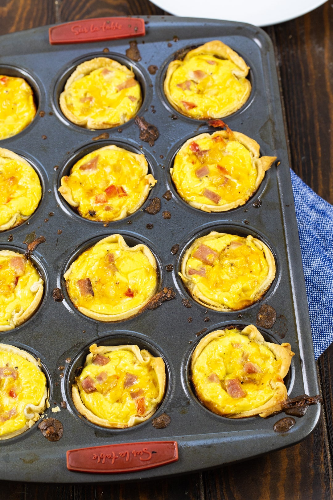 Mini quiche in a muffin tin.