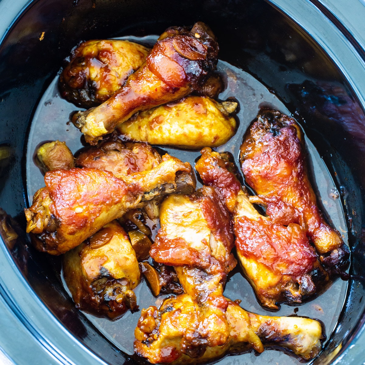 Garlic Peach Chicken Legs in slow cooker.