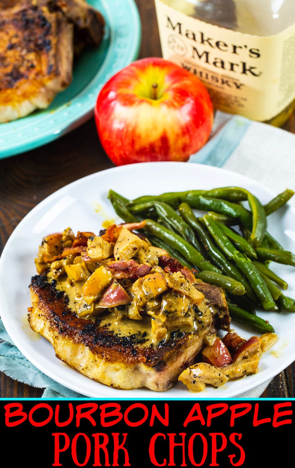 Bourbon Apple Pork Chop on plate with green beans.