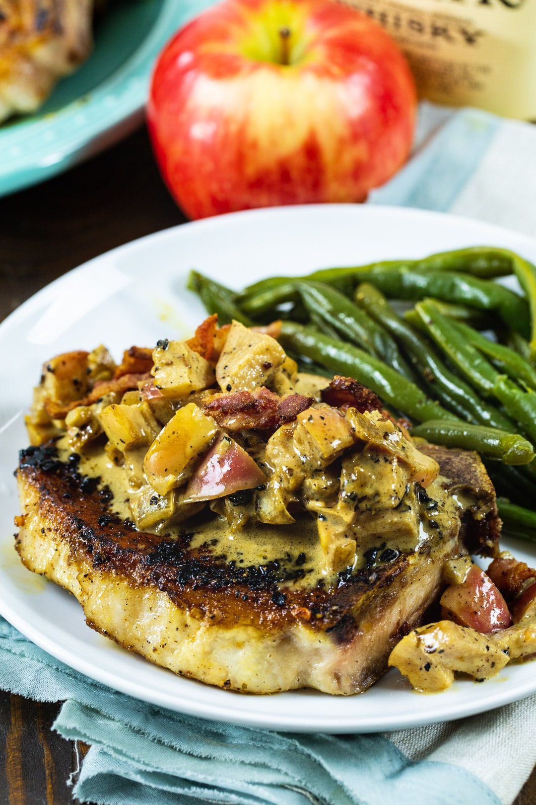 Close-up of cooked pork chop on a plate.