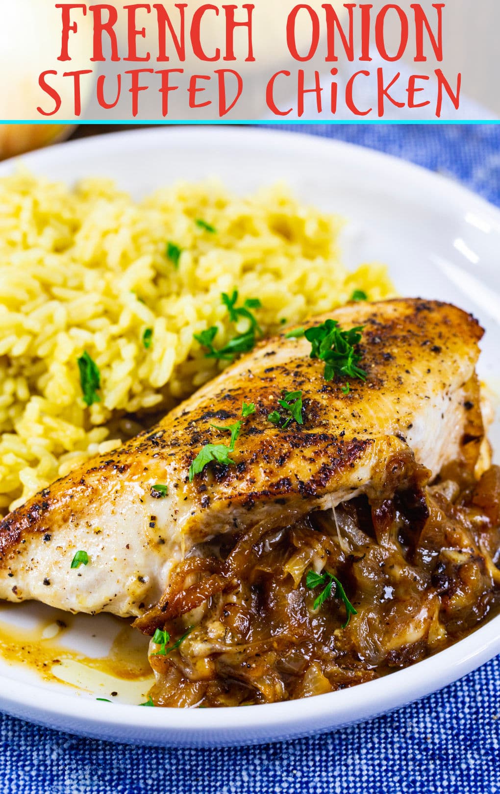 French Onion Stuffed Chicken breast on plate with rice.