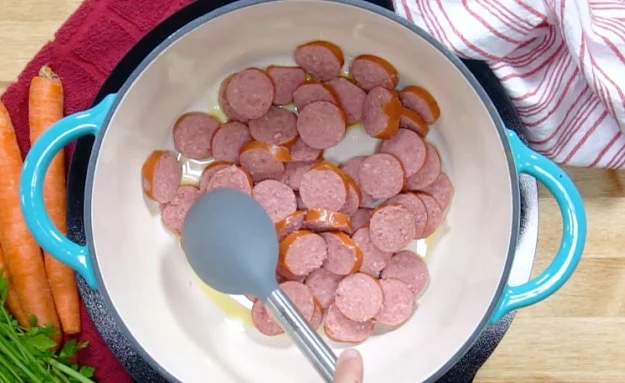 Browning the sausage.