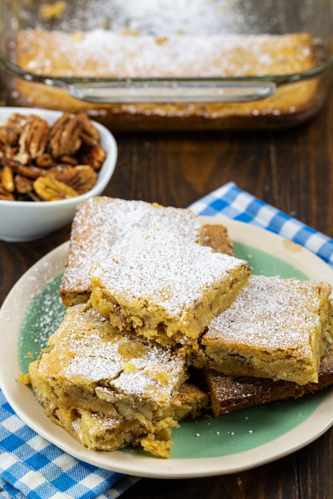 Charleston Chewies on a plate and a bowl of pecans.
