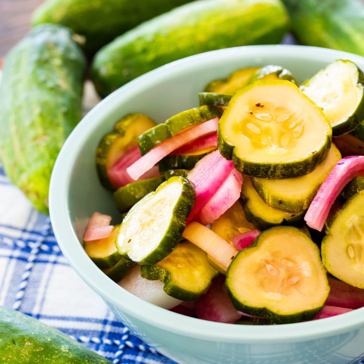 Pickled Cucumbers and Onions in a blue bowl.