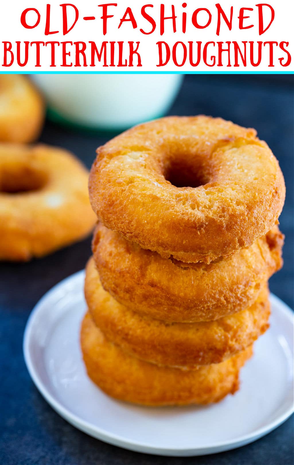 Old-Fashioned Buttermilk Doughnuts stacked on a plate.