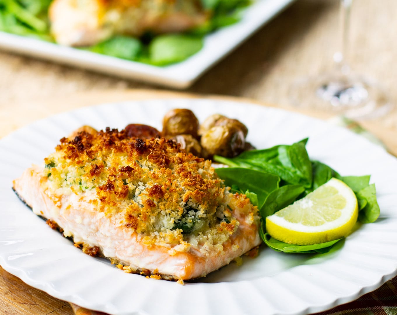 Baked salmon dished up on a plate.
