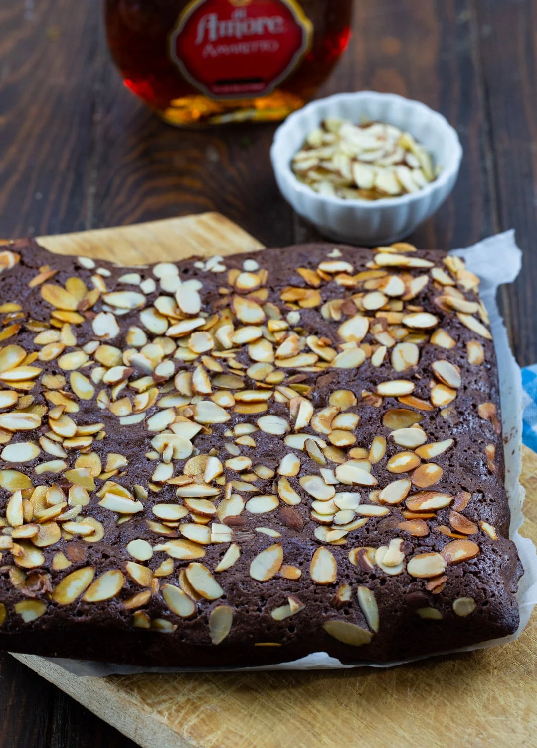 Amaretto Brownies on a wooden cutting board.