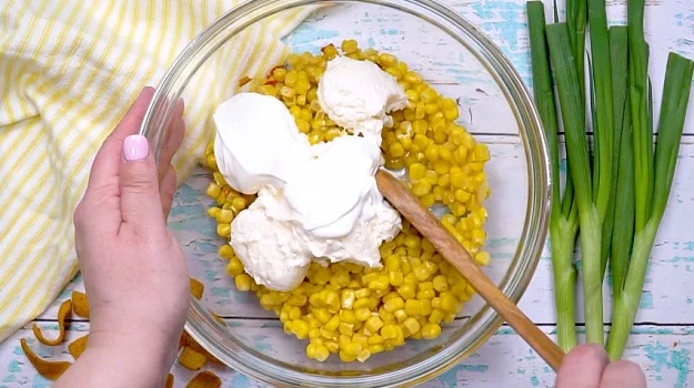 Sour cream and mayonnaise added to corn mixture.