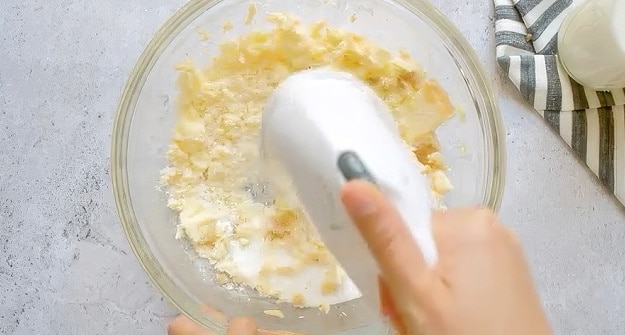Beating butter and sugar.