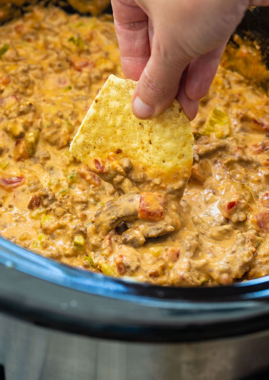 Tortilla chip scooping up dip.