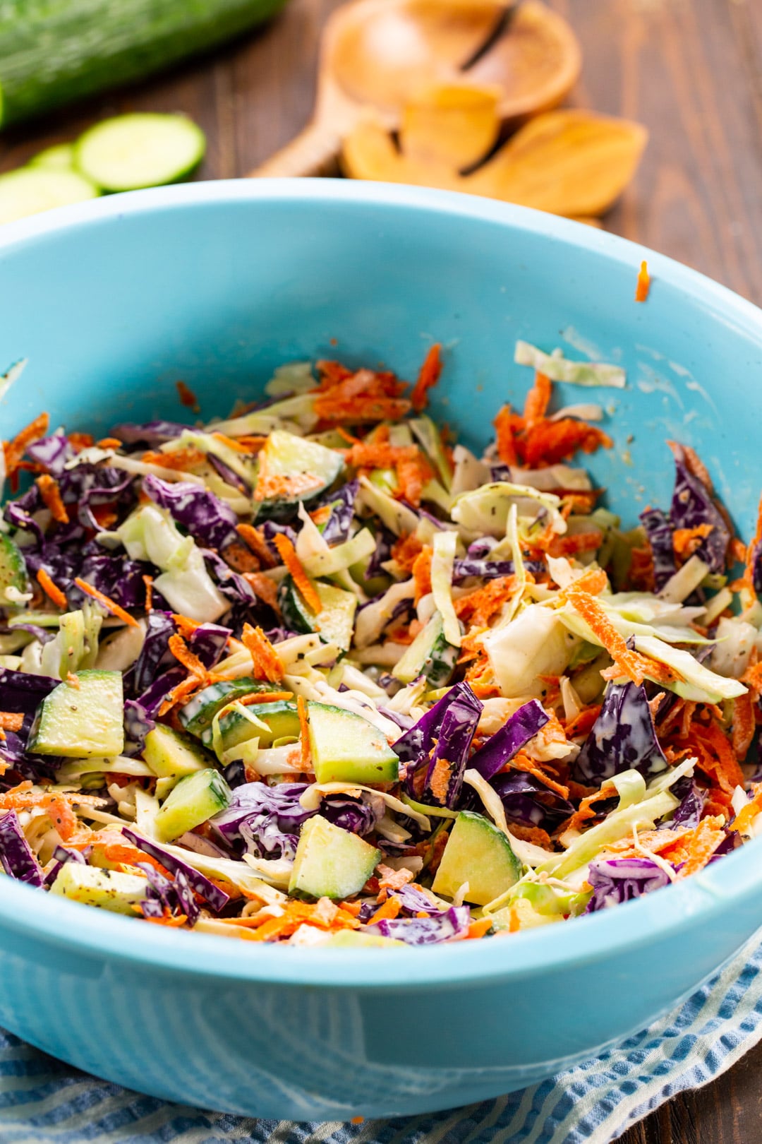 Cucumber Coleslaw in a large blue mixing bowl.