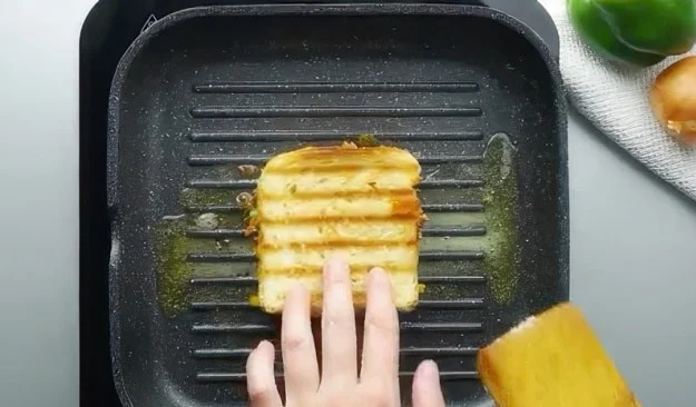 Cooking the sandwich.
