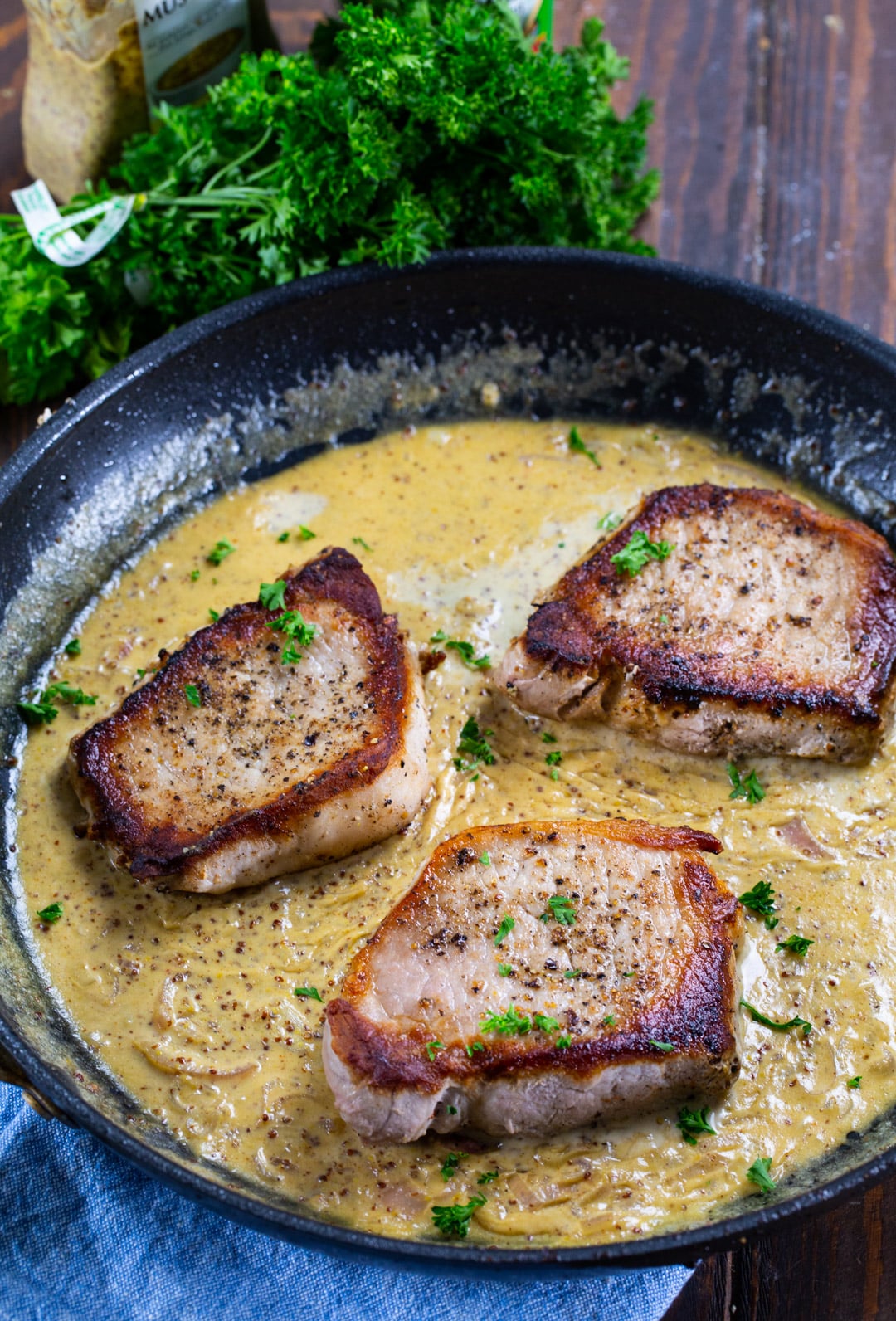 Pork Chops in a skillet.