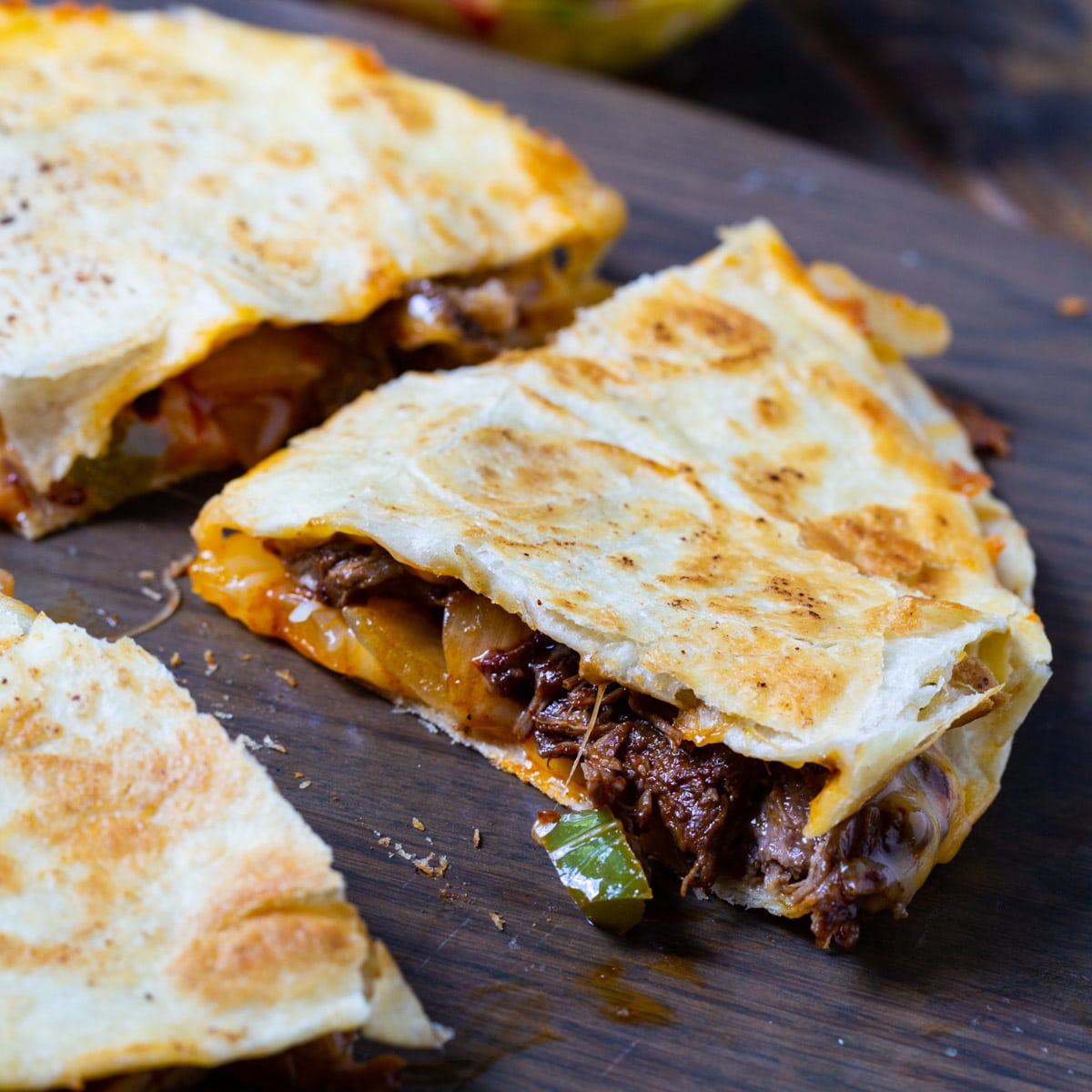Spicy Beef Quesadilla cut into triangles.