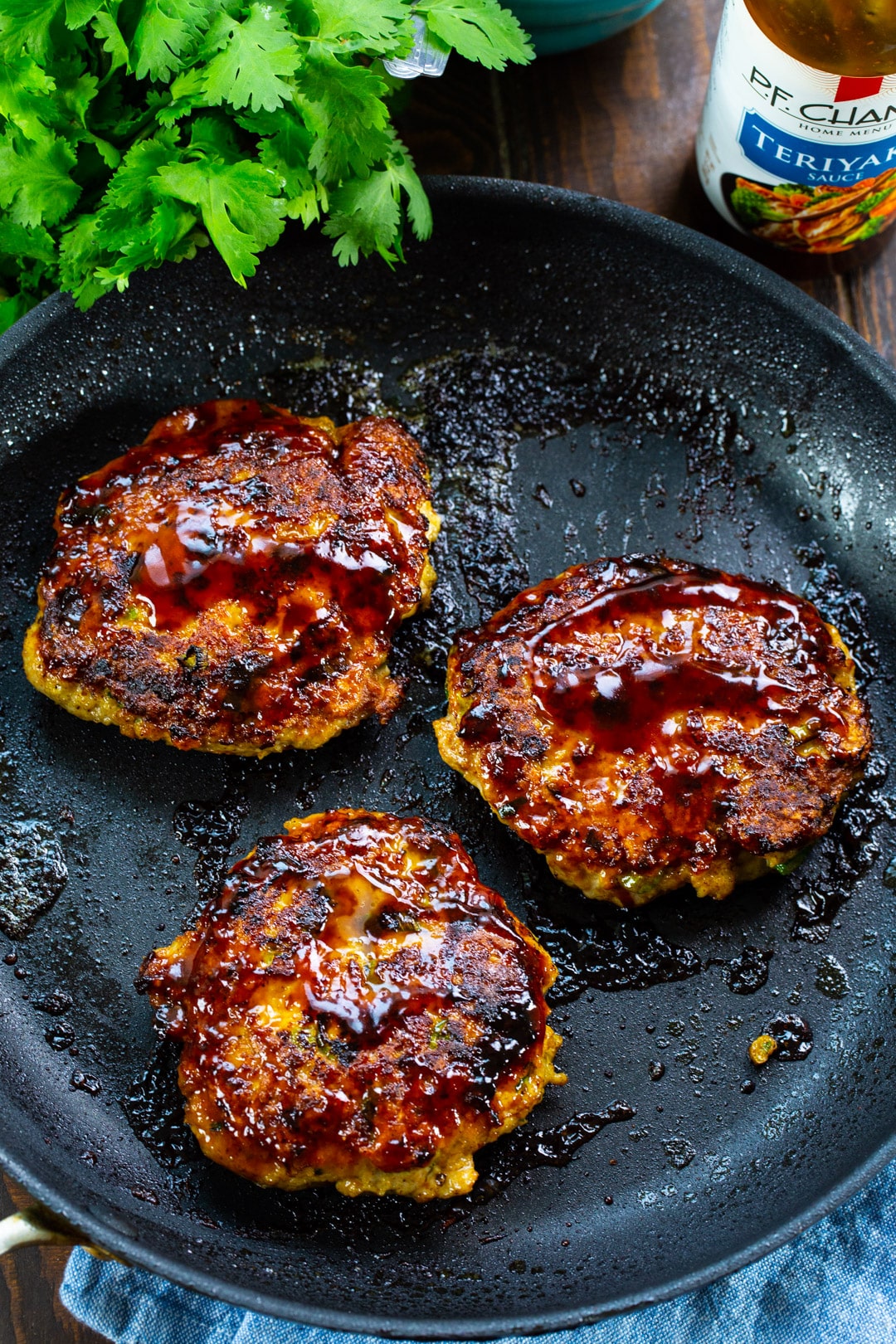 Teriyaki Chicken Burgers in a skillet.