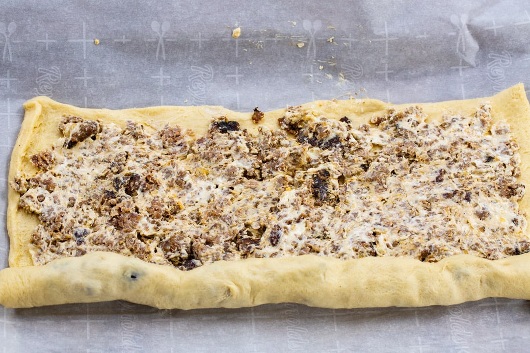 Crescent dough getting rolled up.