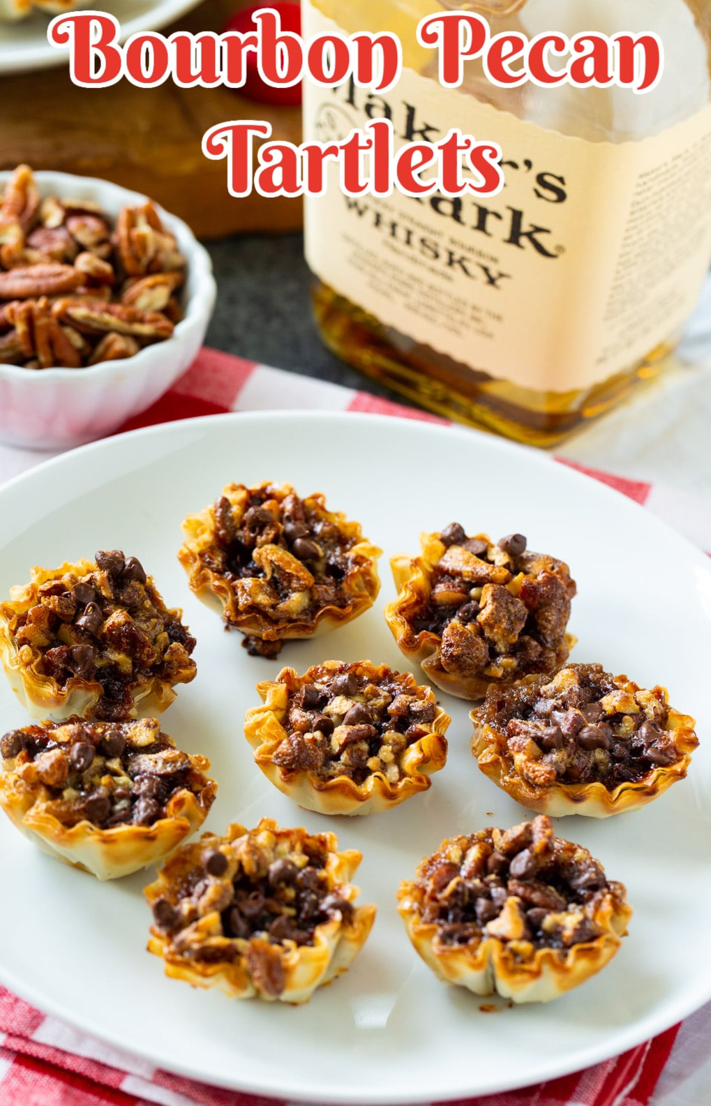 Bourbon Pecan Tartlets and a bottle of bourbon.
