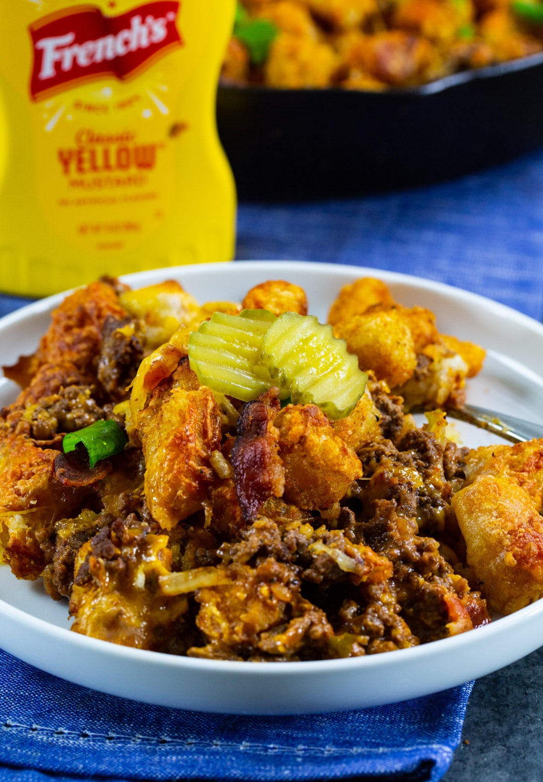 Cheeseburger Tater Tot Casserole dished up on a plate.