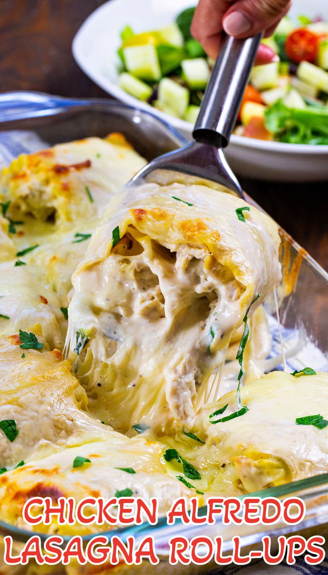 Chicken Alfredo Lasagna Roll-Ups in baking dish.