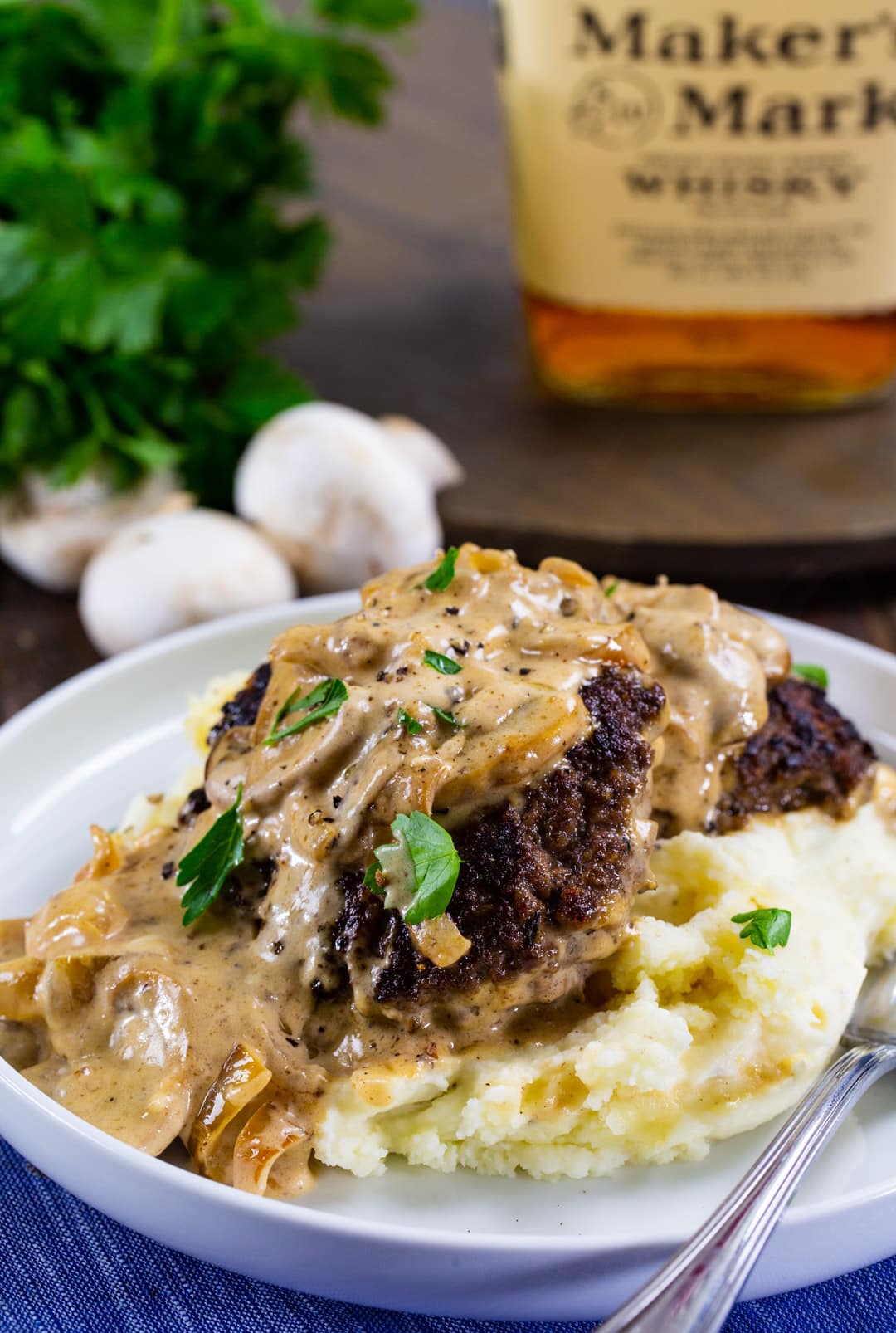 Hamburger Steaks with Bourbon Mushroom Gravy over mashed potatoes.