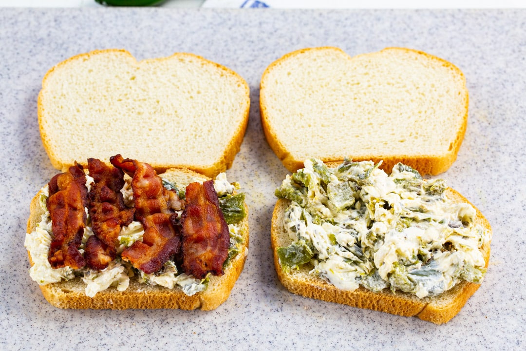 Cream cheese mixture spread on bread slices.