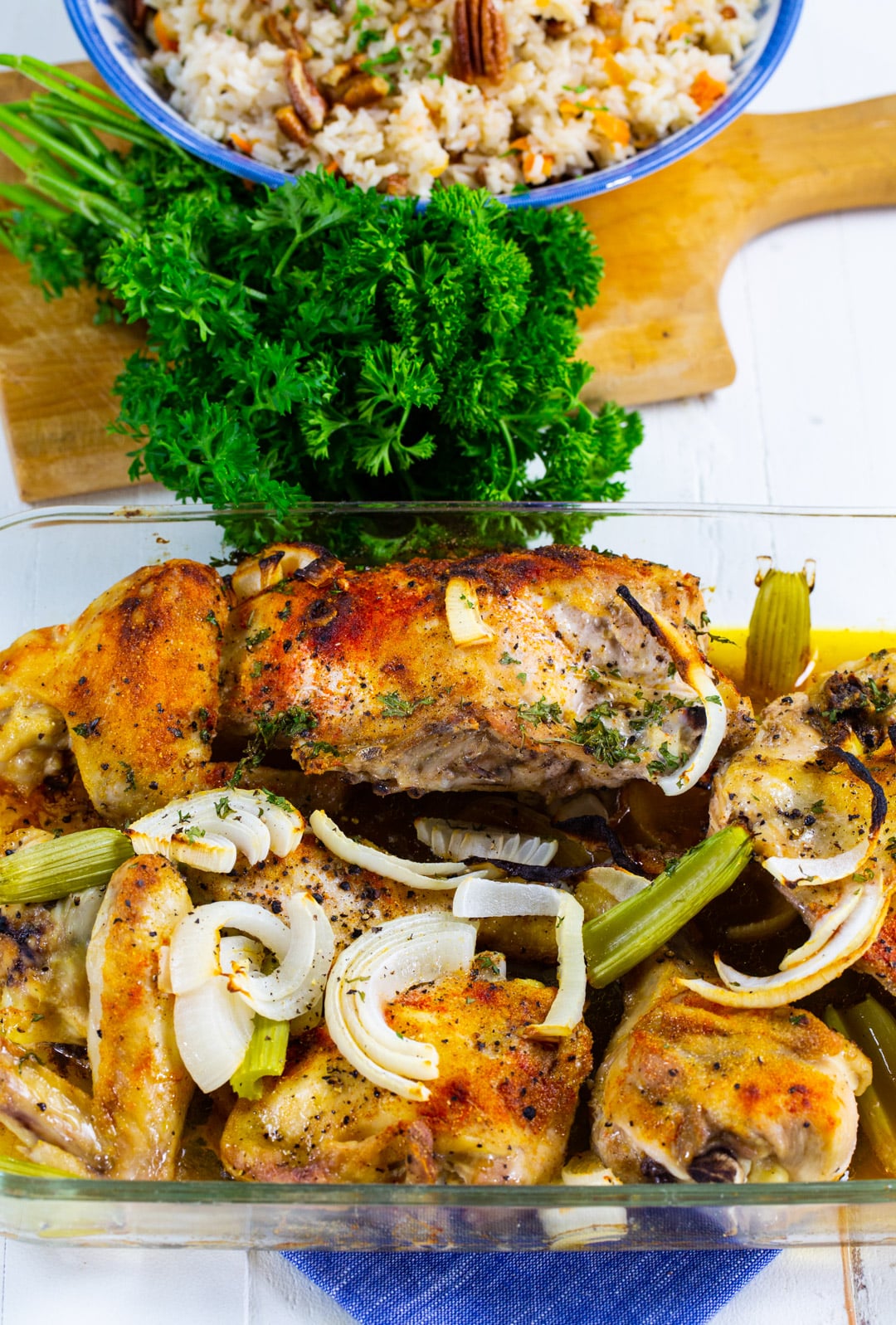 Cooked chickien in baking dish.