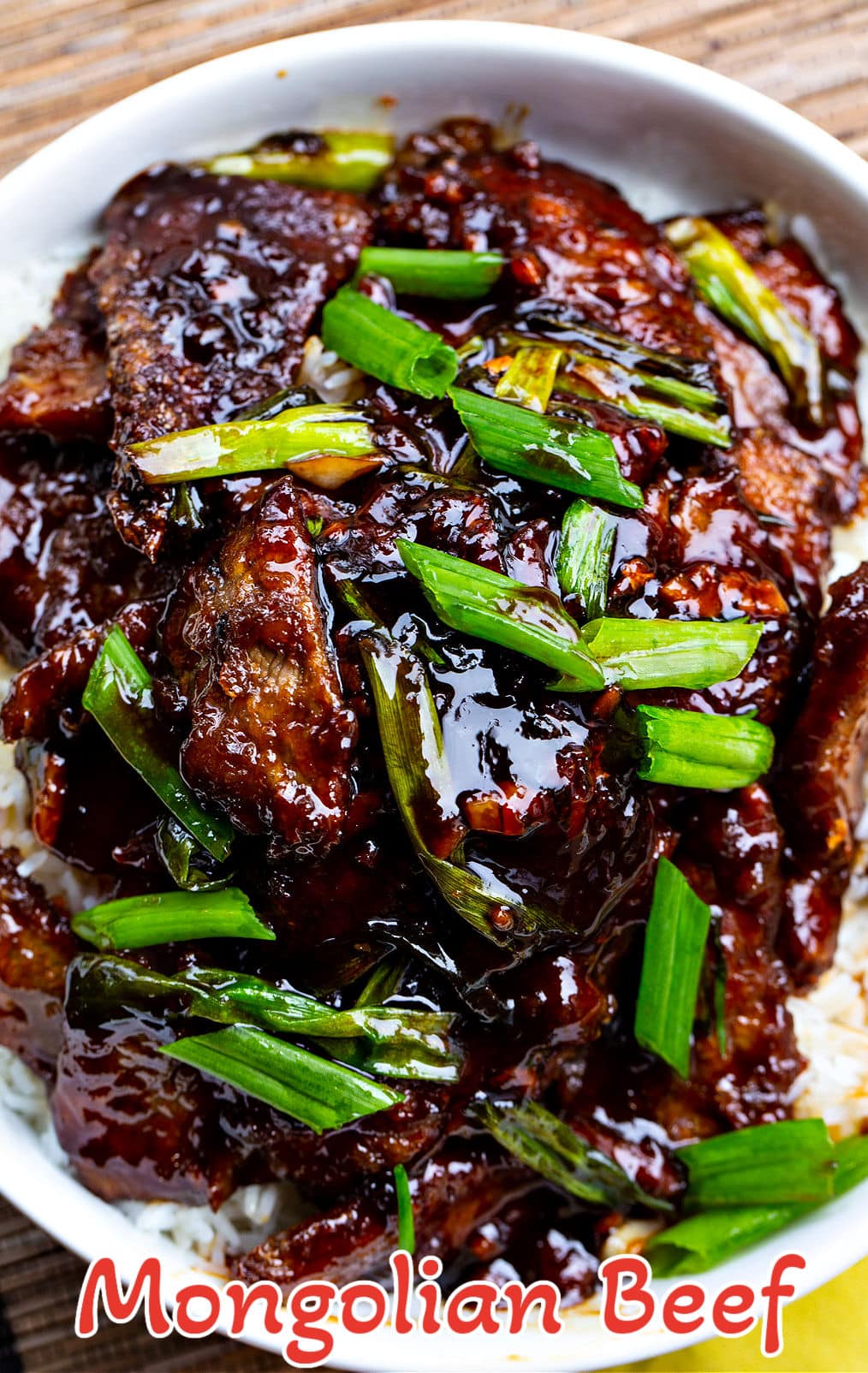 Mongolian Beef over white rice in bowl.