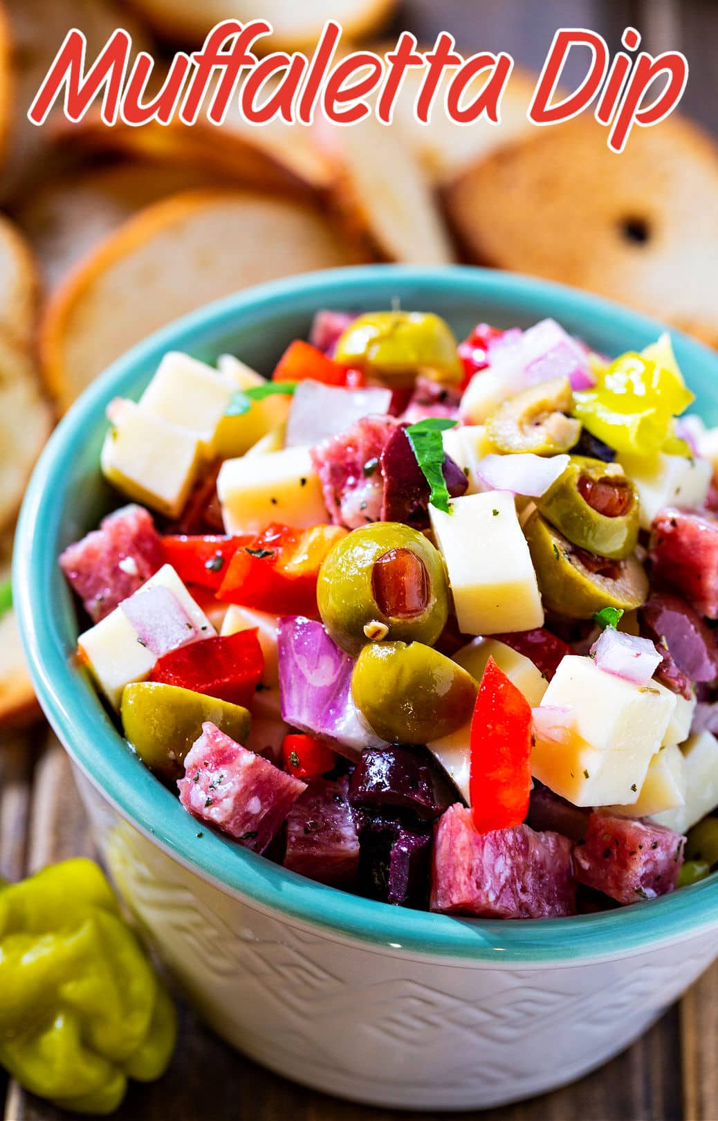 Close-up of Muffaletta Dip in a serving bowl.