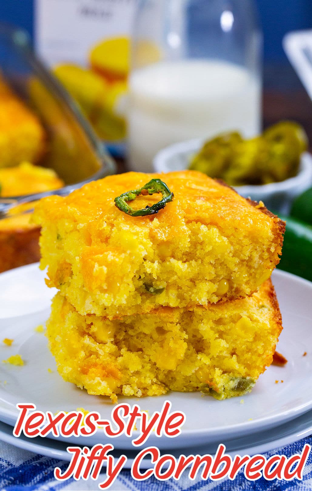 Two pieces of cornbread stacked on a small plate.