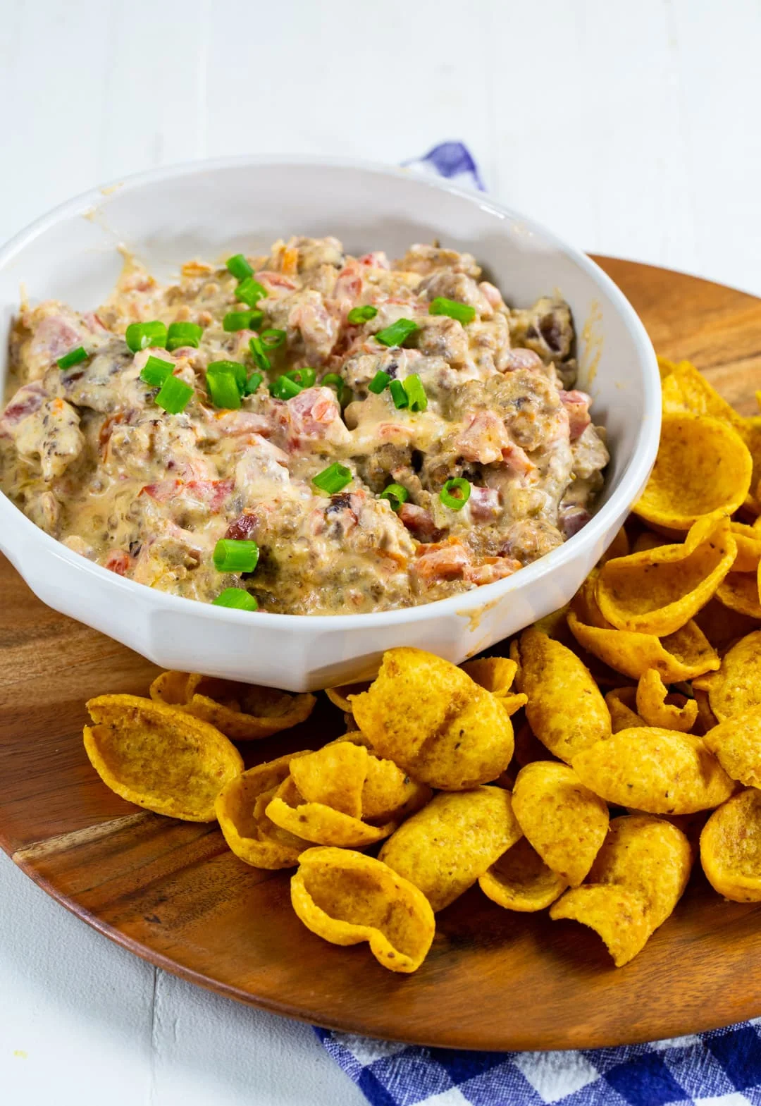 Dip in a bowl surrounded by Frito scoops.