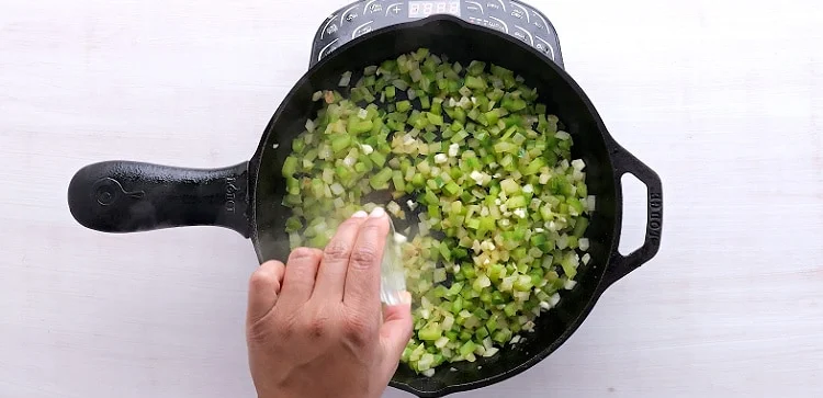 Adding garlic.